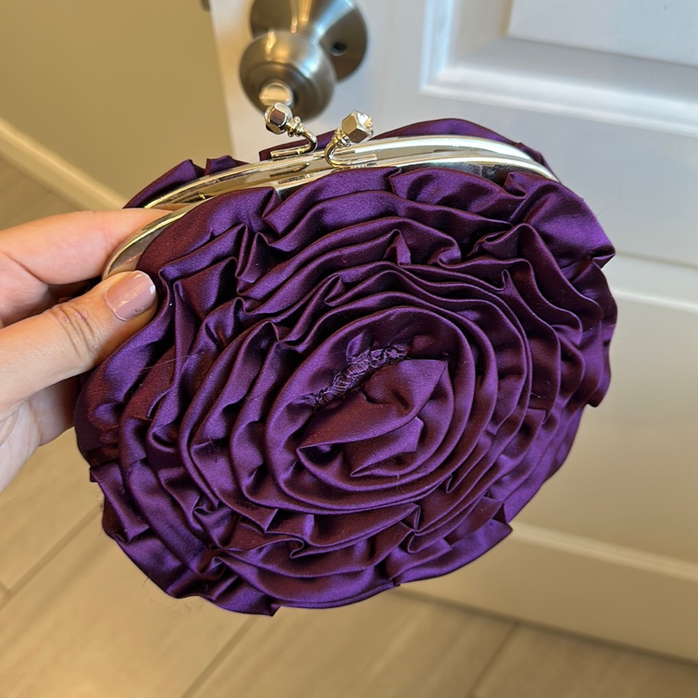 clutch/ shoulder bag available in purple color. excellent condition